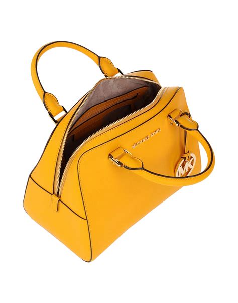 michael kors yellow handbags|yellow michael kors backpack.